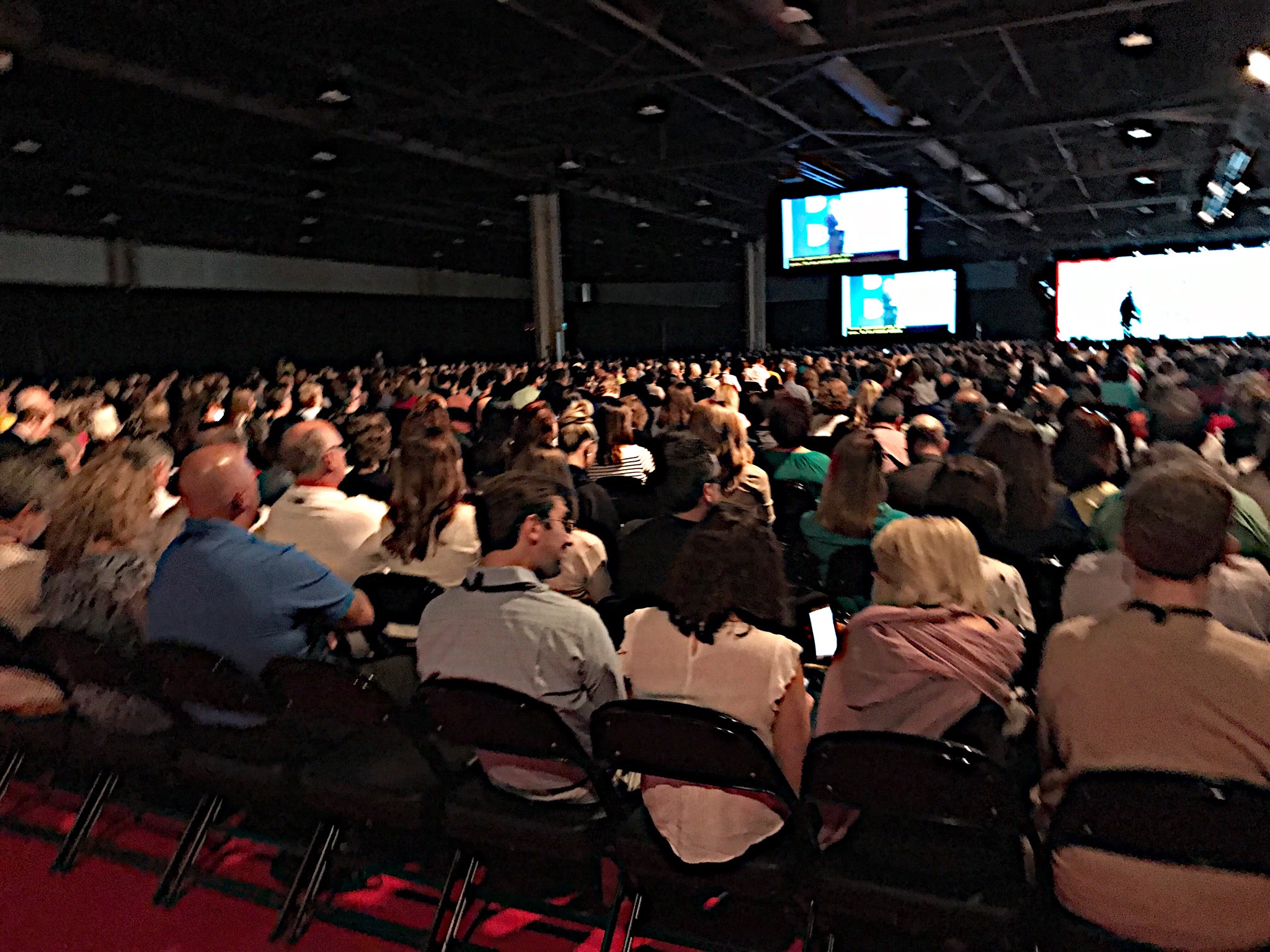 Large audience attending a corporate conference session
